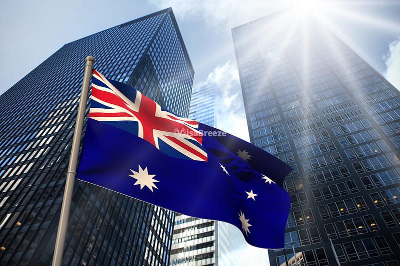 Australian flag in front of two buildings วีซ่าแคนาดา